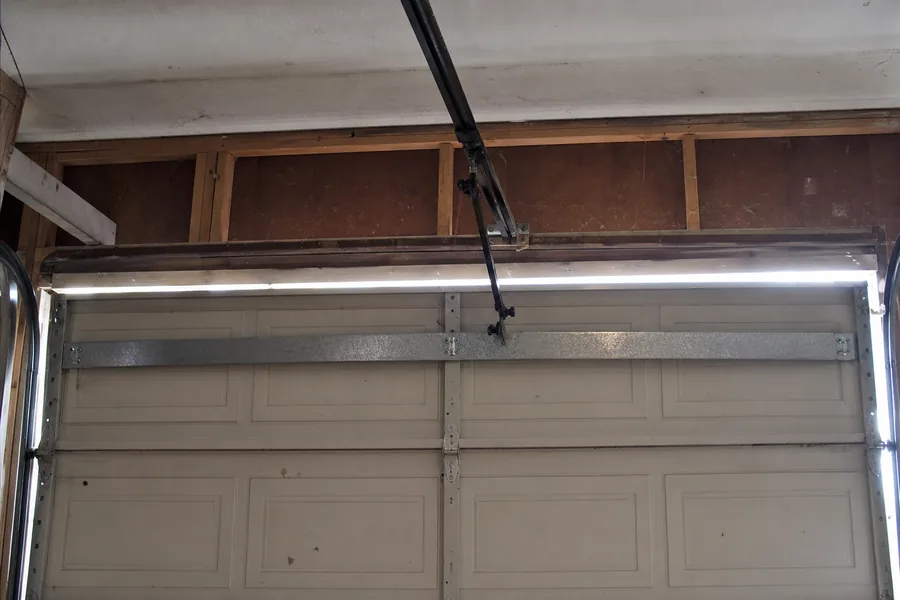 Reinforcement strut across the top panel of a double garage door in Springfield, MO